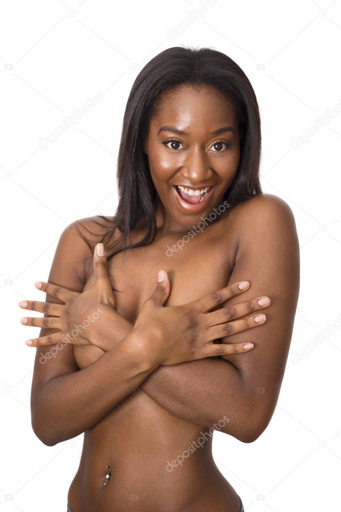 young woman covering her breasts posing topless