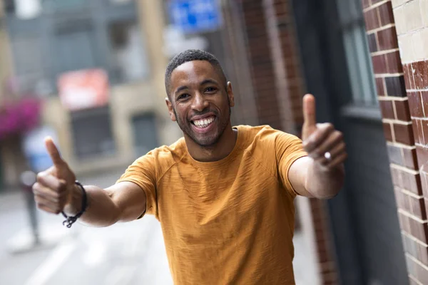 Young Man Showing Thumbs Symbol — Stock Photo, Image