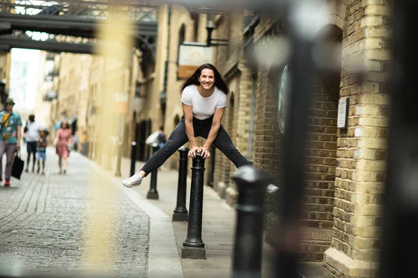 Young Woman Jumping Bollard Street — Stock Photo, Image