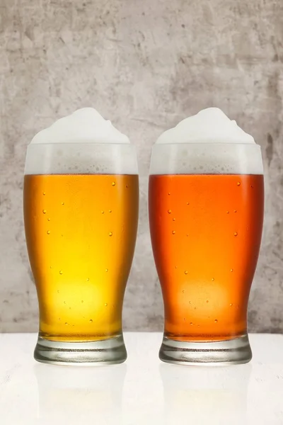 Beer splash in glass on vintage background with copy space — Stock Photo, Image
