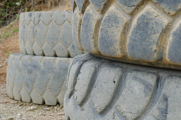 Old and damaged heavy truck tires — Stock Photo, Image