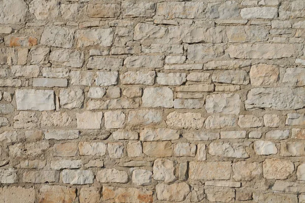 Stone wall made of limestone blocks — Stock Photo, Image