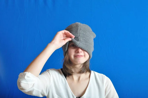 Teen hiding his face with his bonnet. — Stock Photo, Image