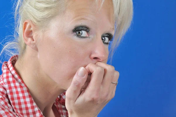 Portrait of young blond woman thinking and looking somewhere up — Stock Photo, Image