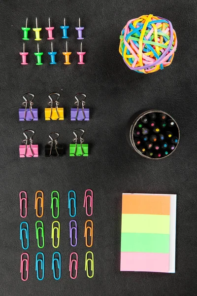 Office supplies on a black table — Stock Photo, Image