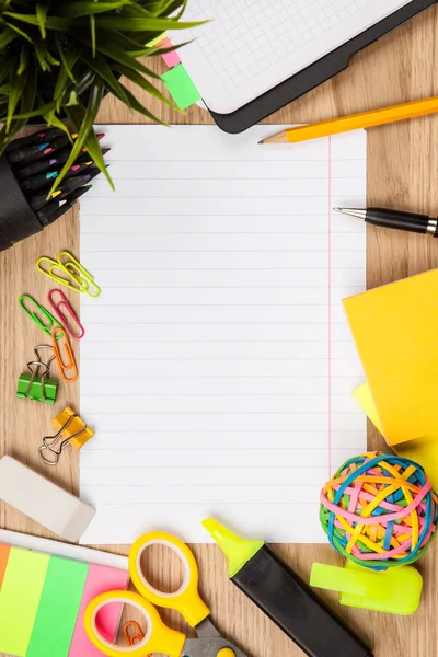 Open notepad with office supplies — Stock Photo, Image