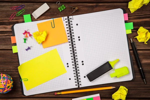 Open notepad with office supplies — Stock Photo, Image