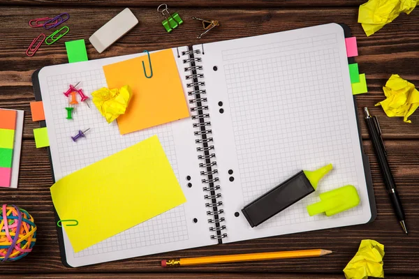 Open notepad with office supplies — Stock Photo, Image