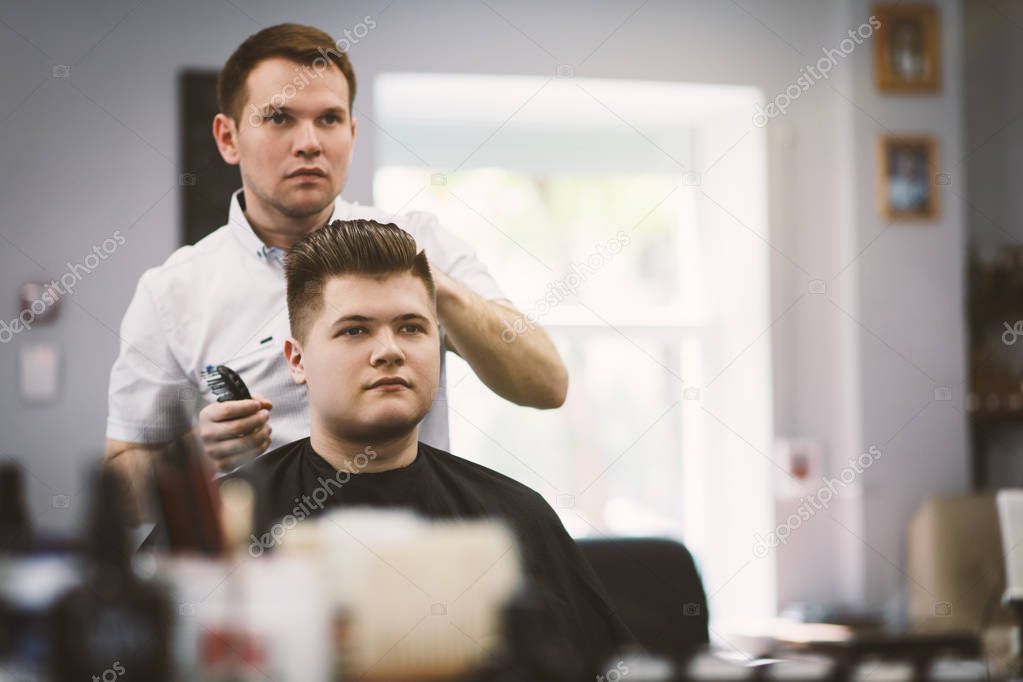 Professional barber doing a haircut