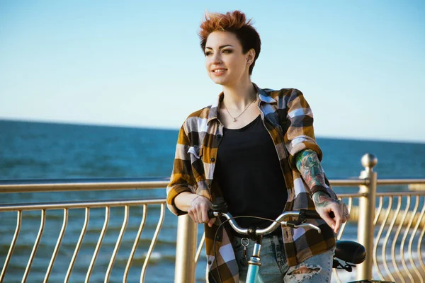 Young woman on a bicycle — Stock Photo, Image