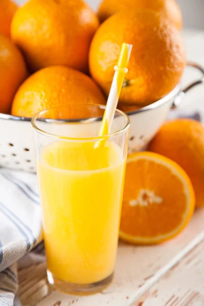 Fresh oranges in a colander — Stock Photo, Image