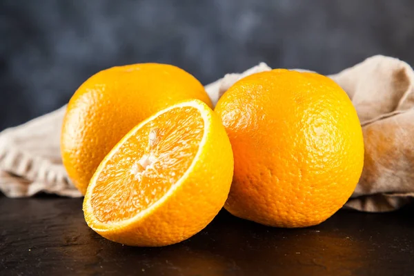 Fresh oranges on dark background — Stock Photo, Image