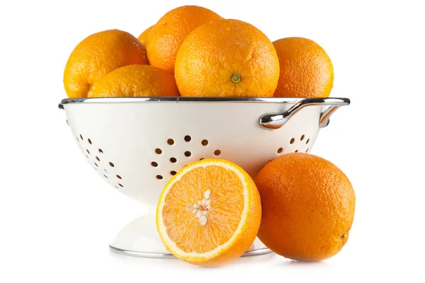 Fresh oranges in a colander — Stock Photo, Image