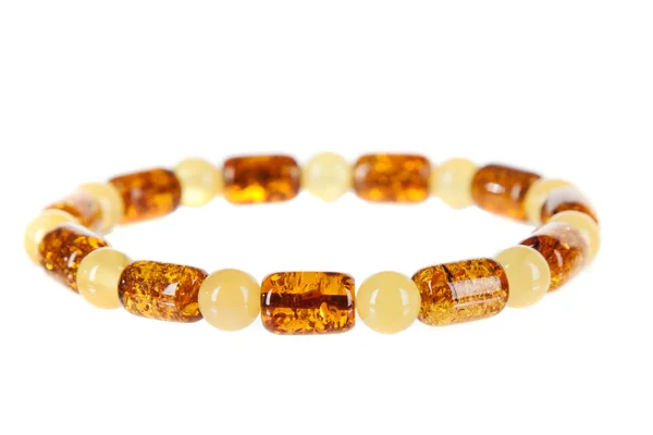 Amber jewelry op witte achtergrond — Stockfoto