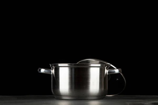 Metal pot on black background — Stock Photo, Image