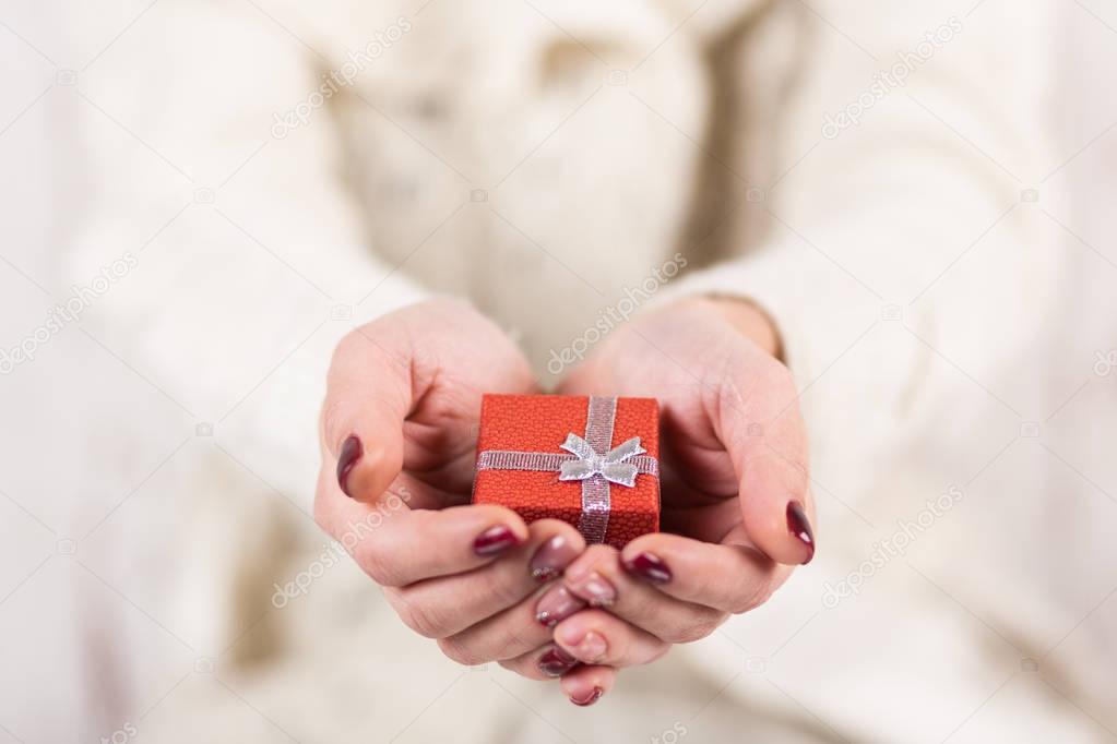 Present box in womans hands