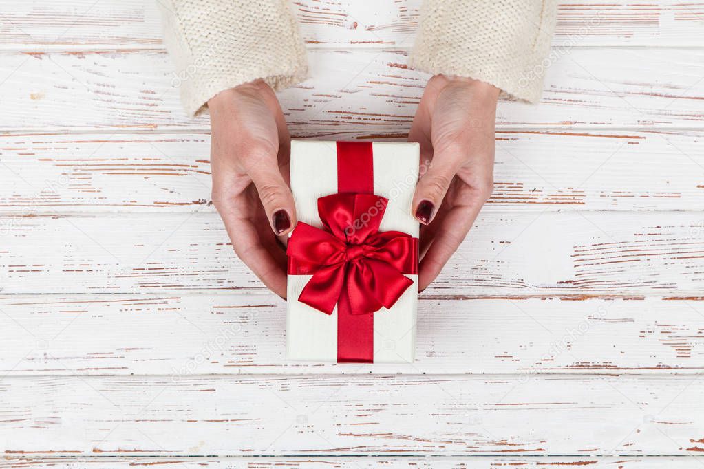 Present box in womans hands