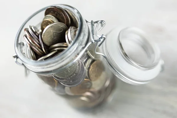 Coins in a glass jar — Stock Photo, Image