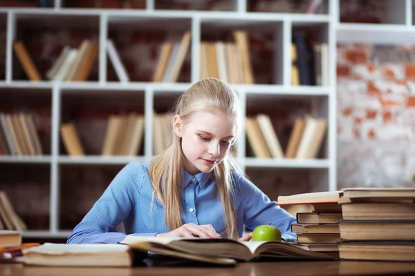 Teenage girl in a library Stock Photo