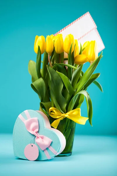 Yellow tulips on blue background — Stock Photo, Image