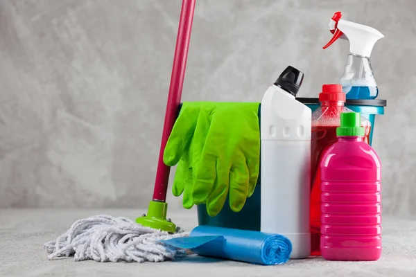 Cleaning supplies on grey background — Stock Photo, Image