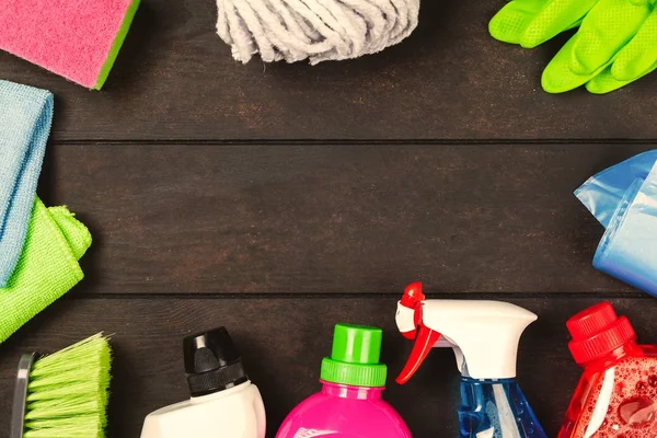 Cleaning supplies on wooden background — Stock Photo, Image