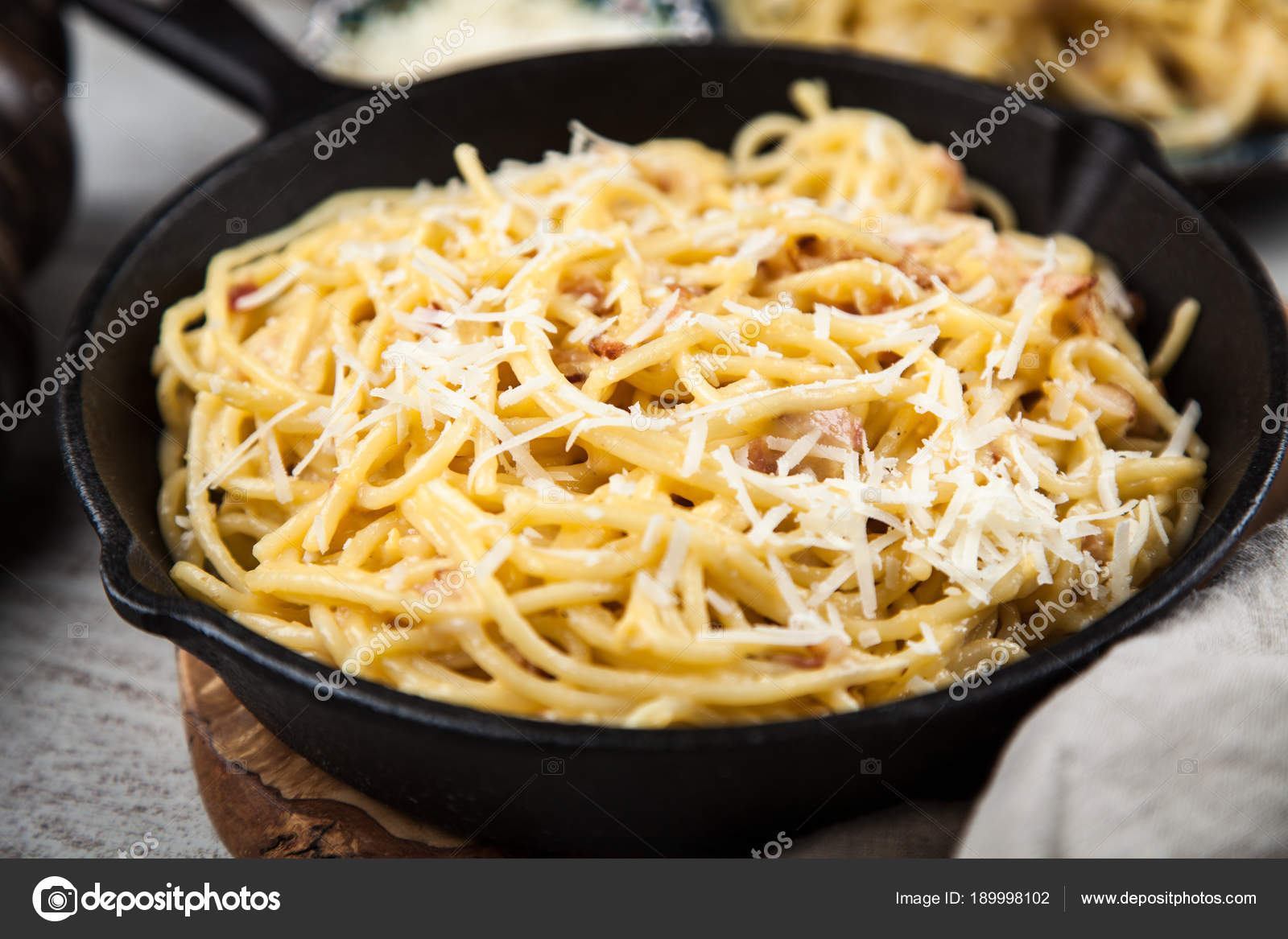 Spaghetti carbonara with egg and pancetta Stock Photo by ©gdolgikh