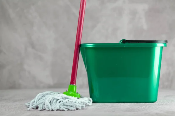 Cleaning supplies on grey background — Stock Photo, Image