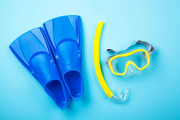 Blue flippers on color background — Stock Photo, Image