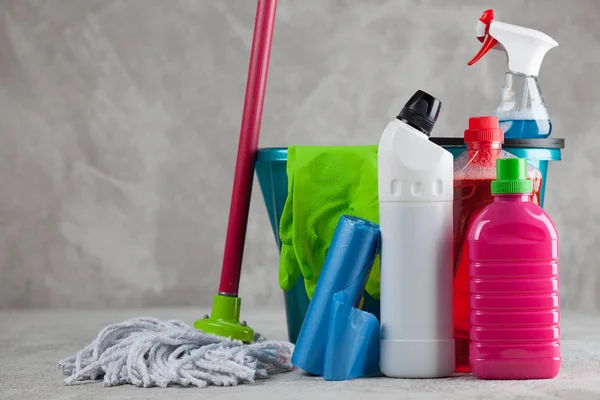 Cleaning supplies on grey background — Stock Photo, Image