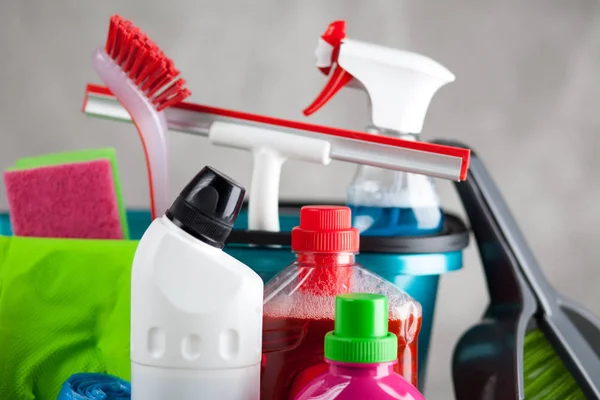 Cleaning supplies on grey background — Stock Photo, Image