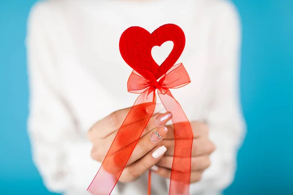 Female hands holding a red heart — Stock Photo, Image