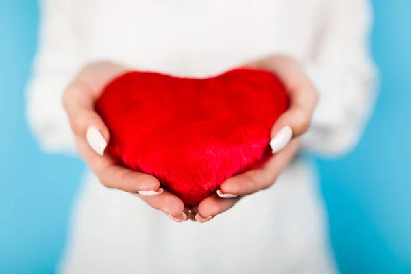 Female hands holding a red heart — Stock Photo, Image