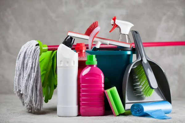 Cleaning supplies on grey background — Stock Photo, Image