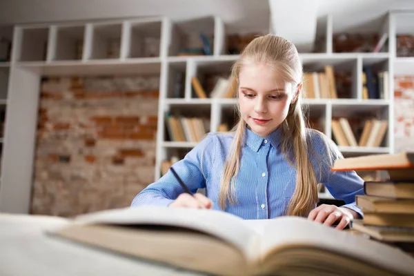 Teenage girl in a library Stock Picture
