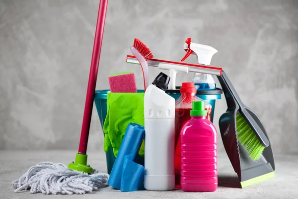 Cleaning supplies on grey background — Stock Photo, Image