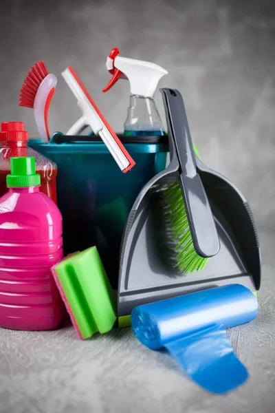 Cleaning supplies on grey background — Stock Photo, Image