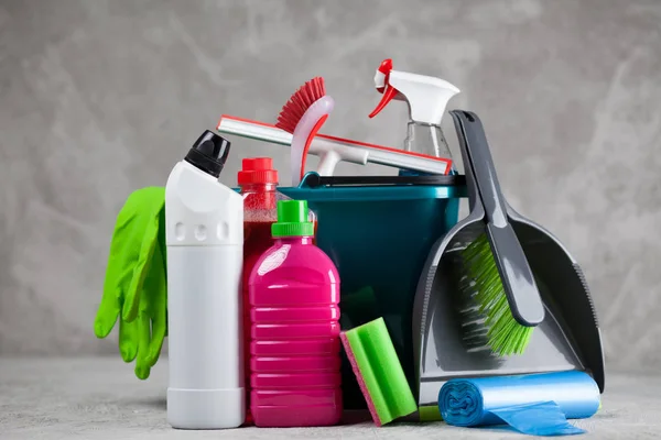 Cleaning supplies on grey background — Stock Photo, Image