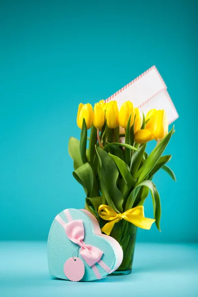 Yellow tulips on blue background — Stock Photo, Image