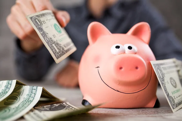 Piggy bank on grey background — Stock Photo, Image