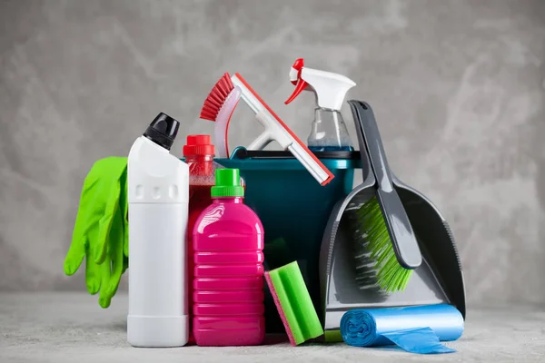 Cleaning supplies on grey background — Stock Photo, Image