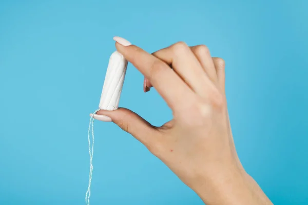 Woman holding a tampon — Stock Photo, Image