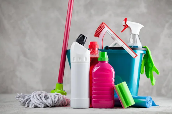 Cleaning supplies on grey background — Stock Photo, Image