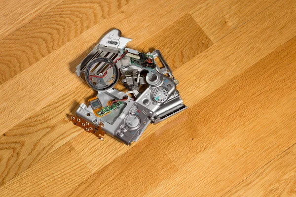 Disassembled broken compact digital camera parts — Stock Photo, Image