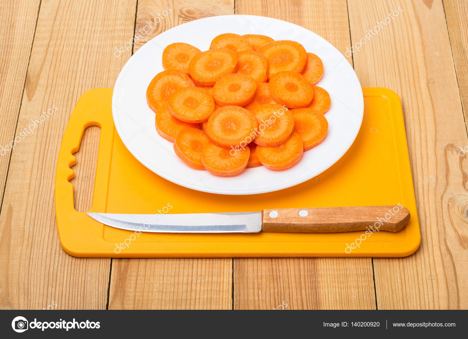 Round Slices Of Carrot In Plate On Plastic Cutting Board Stock Cut Round Slices Of Raw Carrot In Plate On Plastic Cutting Board Wooden Table Photo By Firstblood