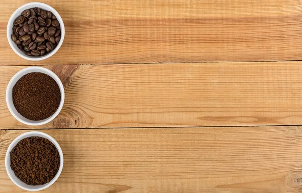 Grain, ground and instant coffee in glass bowls