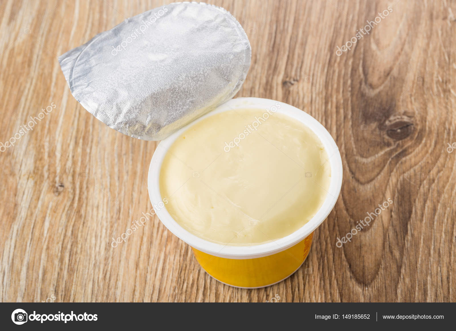 Open Plastic Jar With Melted Cheese On Table Stock Photo Image By C Firstblood