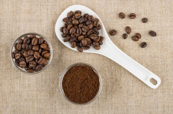 Transparent bowls with coffee beans and ground coffee, plastic s