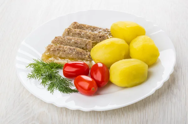 Plate with meat aspic, boiled potatoes, tomatoes, dill on table