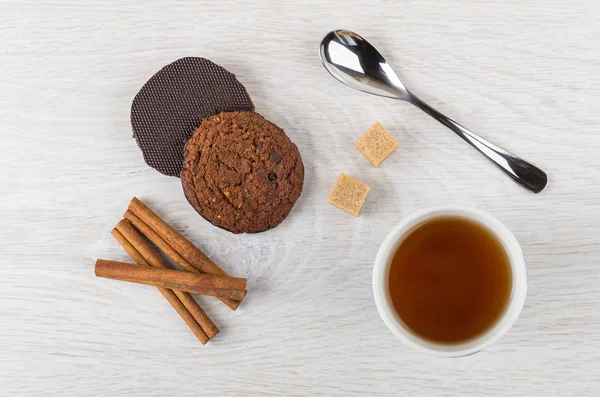 Oatmeal cookies with chocolate, teaspoon, sugar, cinnamon and te